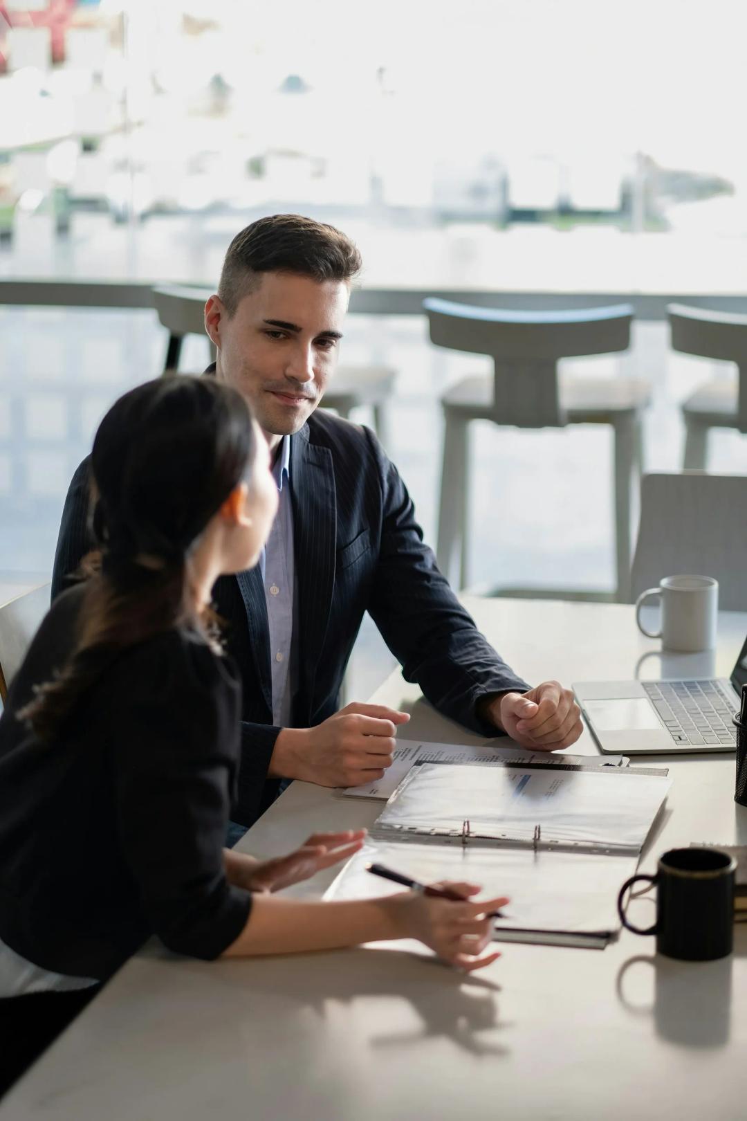 Man and woman working at an office